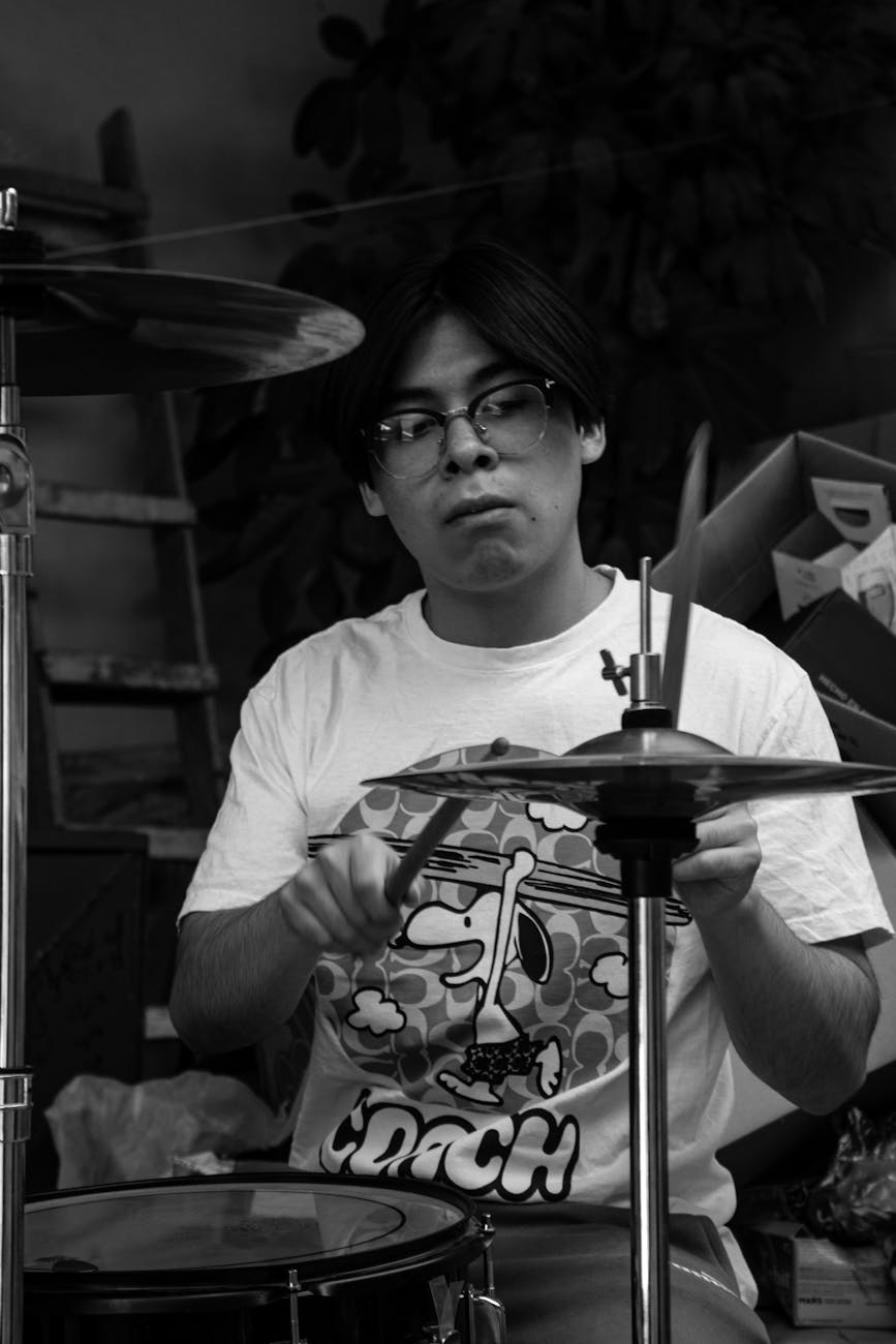 black and white portrait of a young drummer